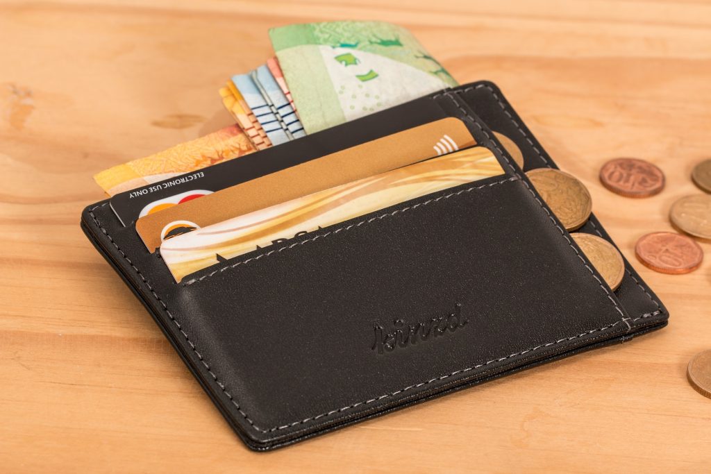Image of a wallet with cash and cards in it