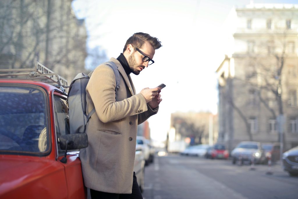 Image of male looking at his phone